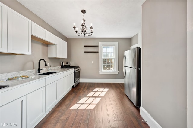6813 W Clinton Ave, Cleveland, OH 44102 - kitchen with stainless steel appliances, a sink, open shelves, white cabinetry, and a chandelier
