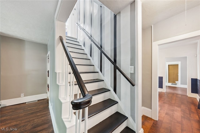 6813 W Clinton Ave, Cleveland, OH 44102 - stairs with baseboards, wood finished floors, and a textured ceiling