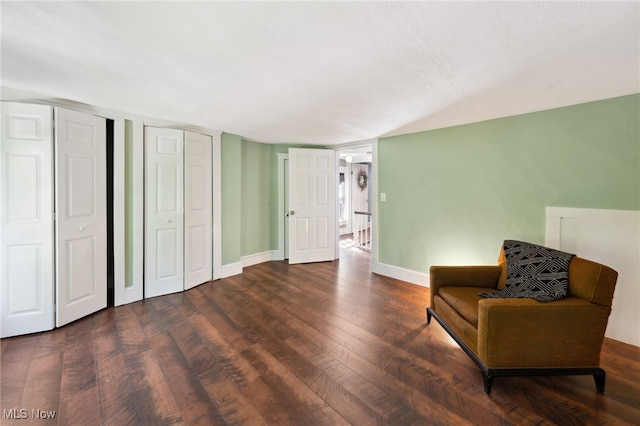 6813 W Clinton Ave, Cleveland, OH 44102 - sitting room featuring wood finished floors, baseboards, and vaulted ceiling