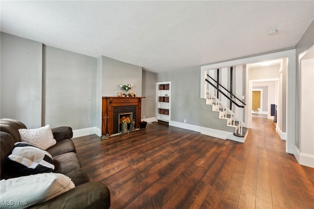 6813 W Clinton Ave, Cleveland, OH 44102 - living area with stairs, dark wood finished floors, and baseboards
