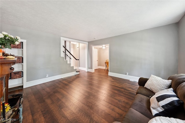 6813 W Clinton Ave, Cleveland, OH 44102 - living area with hardwood / wood-style floors, baseboards, and stairway