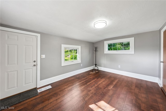 6813 W Clinton Ave, Cleveland, OH 44102 - foyer with dark wood finished floors and baseboards
