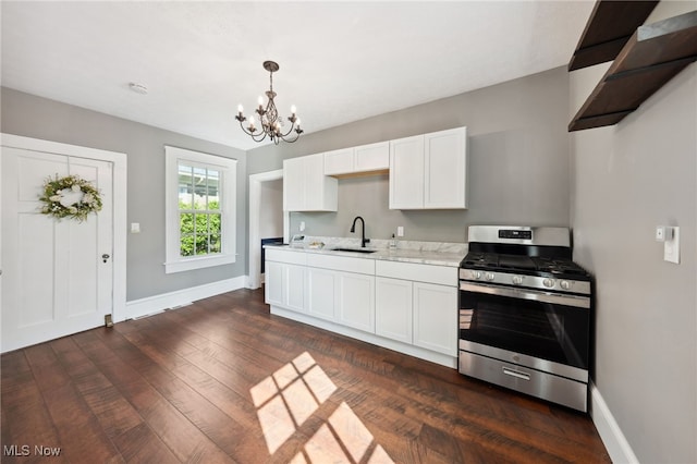 6813 W Clinton Ave, Cleveland, OH 44102 - kitchen featuring stainless steel range with gas cooktop, a sink, a chandelier, dark wood finished floors, and baseboards