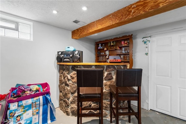 380 E 328th St, Willowick, OH 44095 - indoor dry bar featuring concrete flooring and a textured ceiling