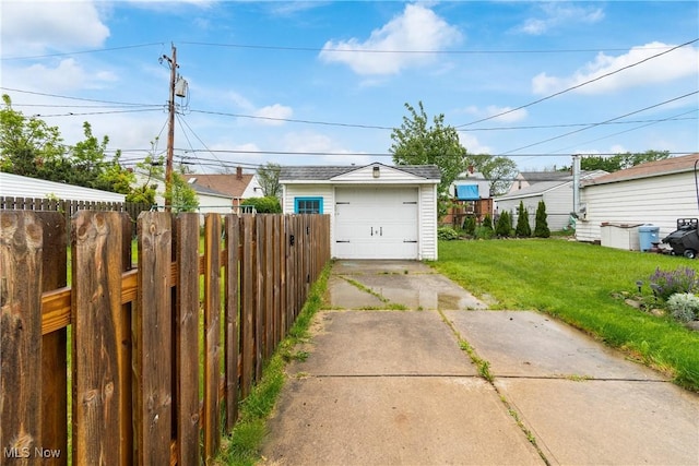 380 E 328th St, Willowick, OH 44095 - view of yard featuring concrete driveway, a detached garage, and an outdoor structure