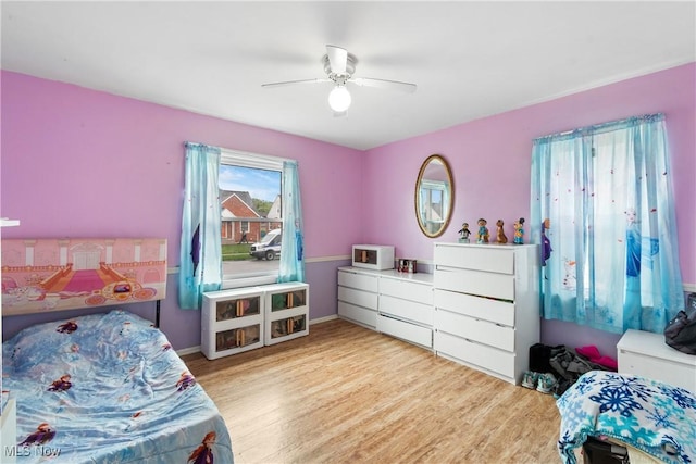 380 E 328th St, Willowick, OH 44095 - bedroom featuring wood finished floors, a ceiling fan, and baseboards