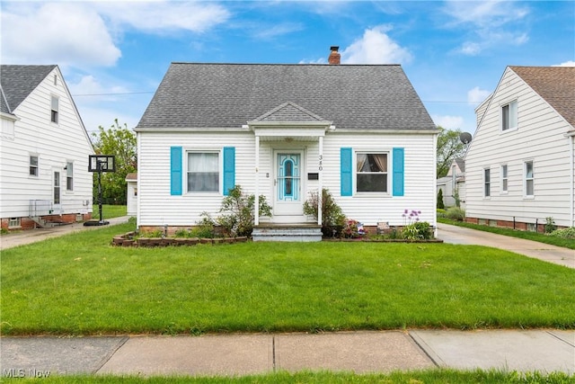 380 E 328th St, Willowick, OH 44095 - cape cod home with a chimney, a front yard, and a shingled roof