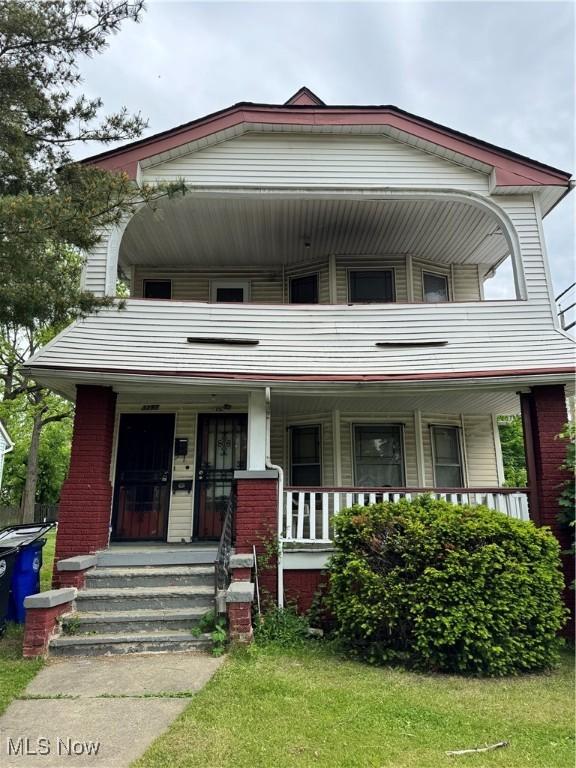 3293 E 121st St, Cleveland, OH 44120 - view of front of house featuring covered porch and a balcony