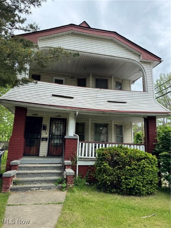 3293 E 121st St, Cleveland, OH 44120 - view of front of house with covered porch and a balcony