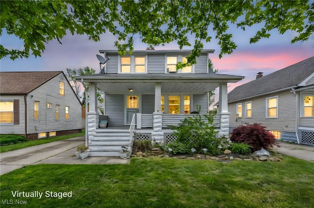 4521 W 147th St, Cleveland, OH 44135 - view of front of house featuring a porch and a lawn