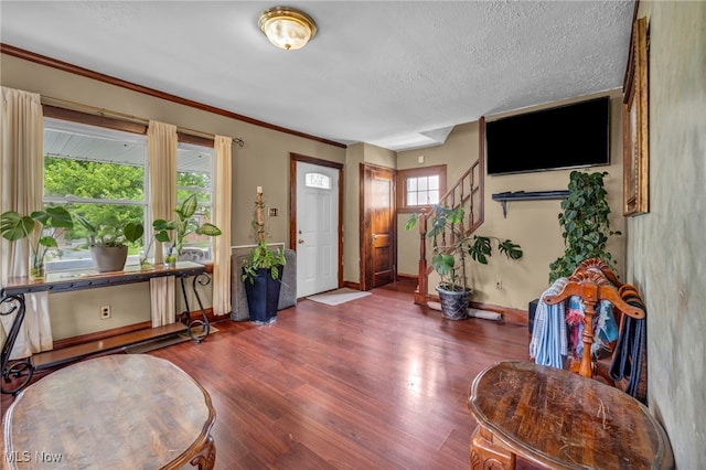 4521 W 147th St, Cleveland, OH 44135 - entryway featuring wood finished floors, baseboards, stairway, and a textured ceiling