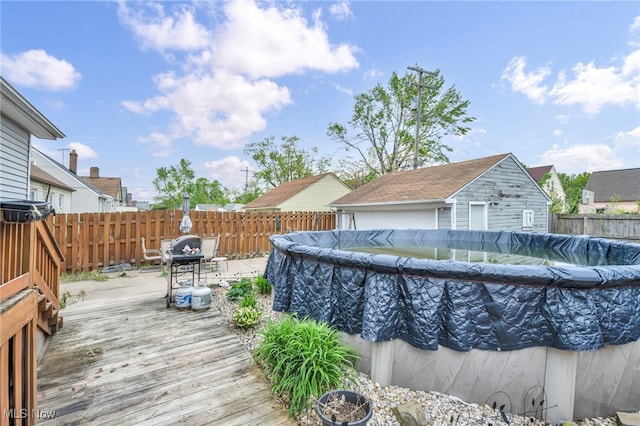 4521 W 147th St, Cleveland, OH 44135 - view of swimming pool featuring a deck and a fenced backyard