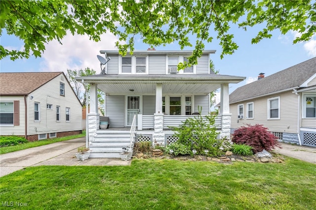 4521 W 147th St, Cleveland, OH 44135 - view of front facade with a porch and a front yard