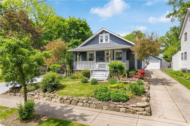 794 Ranney St, Akron, OH 44310 - view of front of property featuring covered porch, a detached garage, and central air condition unit