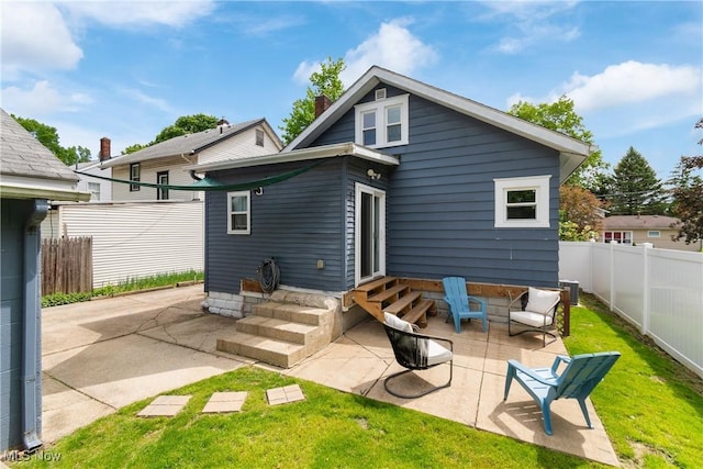794 Ranney St, Akron, OH 44310 - back of property featuring entry steps, a patio, and central air condition unit