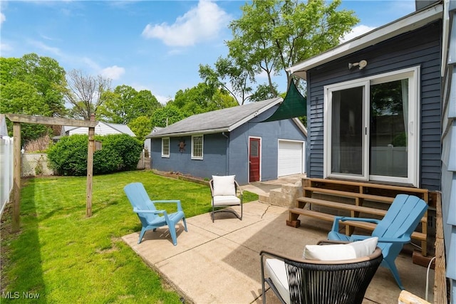 794 Ranney St, Akron, OH 44310 - view of patio featuring entry steps, a detached garage, and an outdoor structure