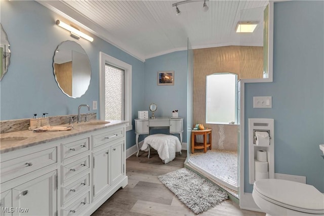 1837 E Erie Ave, Lorain, OH 44052 - full bath featuring crown molding, double vanity, lofted ceiling, toilet, and wood finished floors