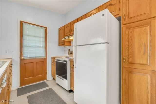 36948 S Lake Shore Blvd, Eastlake, OH 44095 - kitchen featuring white appliances, under cabinet range hood, and light countertops