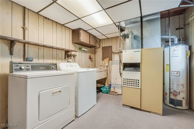 36948 S Lake Shore Blvd, Eastlake, OH 44095 - washroom featuring water heater, washing machine and clothes dryer, wood walls, and heating unit