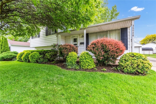 36948 S Lake Shore Blvd, Eastlake, OH 44095 - view of front of house featuring a front yard and a garage