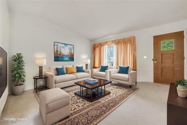 36948 S Lake Shore Blvd, Eastlake, OH 44095 - living room with carpet floors, healthy amount of natural light, and vaulted ceiling