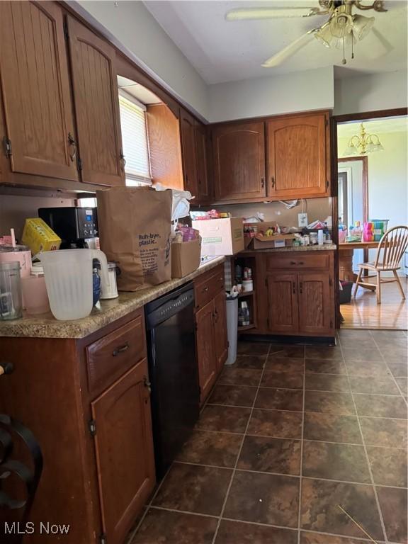 1009 Bogart Rd, Huron, OH 44839 - kitchen featuring black dishwasher, a ceiling fan, light countertops, and brown cabinetry