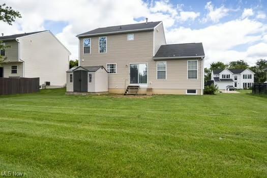 734 Sparrow Way, Wadsworth, OH 44281 - rear view of property with entry steps and a yard