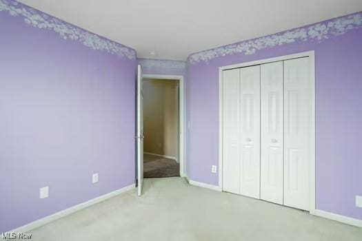 734 Sparrow Way, Wadsworth, OH 44281 - unfurnished bedroom with baseboards, carpet flooring, and a closet