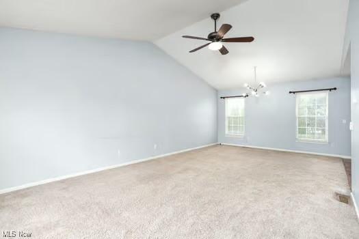 734 Sparrow Way, Wadsworth, OH 44281 - spare room with vaulted ceiling, carpet, a ceiling fan, baseboards, and a chandelier