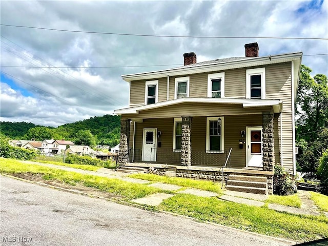 422 Whitely St, Bridgeport, OH 43912 - view of front of home featuring a chimney and covered porch