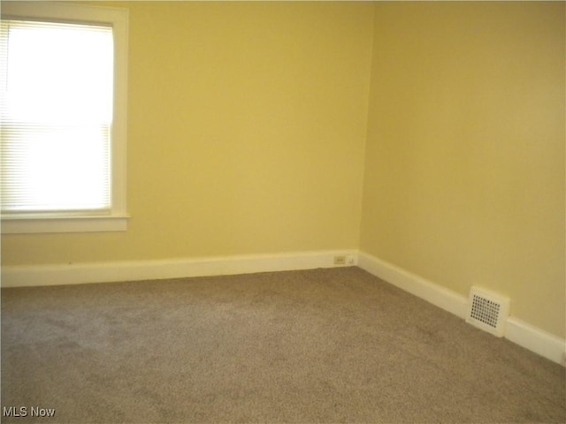 161 25th St NW, Barberton, OH 44203 - unfurnished room with carpet flooring and baseboards