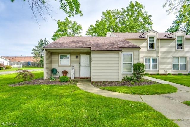 2377 Ansley St, Alliance, OH 44601 - view of front of home with a front lawn and a shingled roof