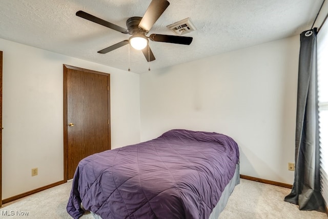 2377 Ansley St, Alliance, OH 44601 - bedroom with light colored carpet, a textured ceiling, baseboards, and ceiling fan