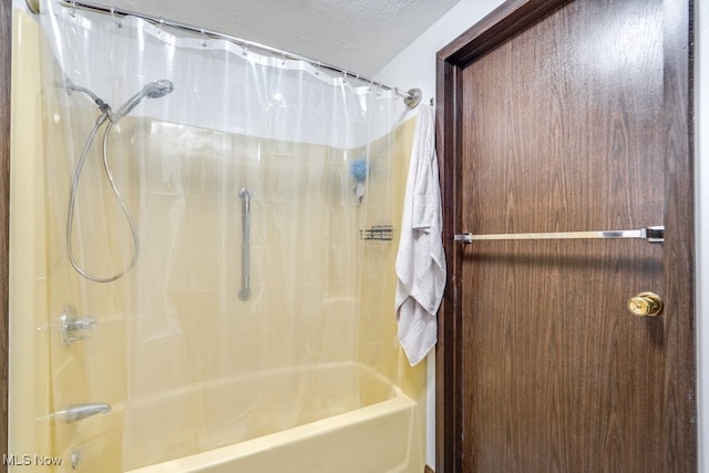 2377 Ansley St, Alliance, OH 44601 - full bath featuring shower / bath combination with curtain and a textured ceiling