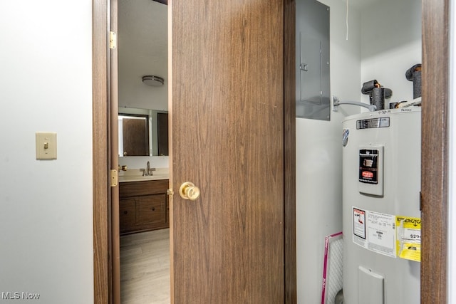 2377 Ansley St, Alliance, OH 44601 - utilities featuring water heater, electric panel, and a sink