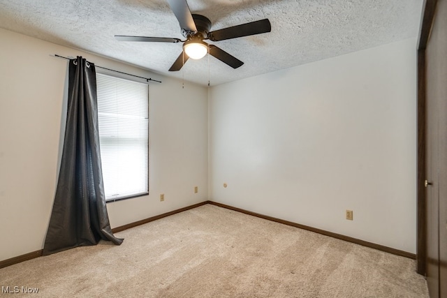 2377 Ansley St, Alliance, OH 44601 - unfurnished room with light colored carpet, plenty of natural light, ceiling fan, and a textured ceiling