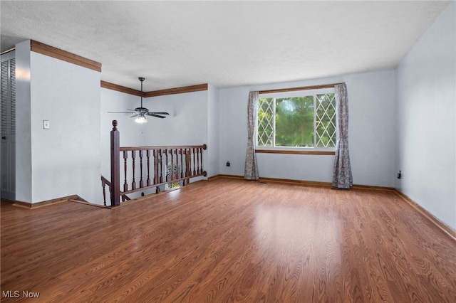 3067 Bronco Dr, Clinton, OH 44216 - empty room featuring wood finished floors, ceiling fan, and baseboards