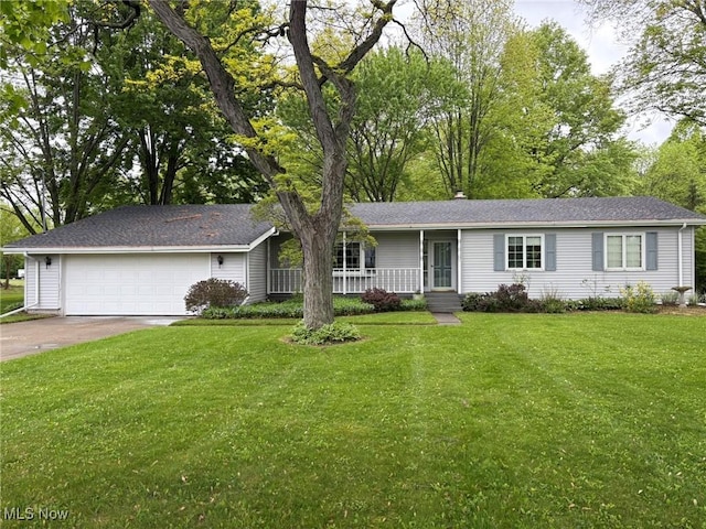 12709 Pyle S Amherst Rd, Oberlin, OH 44074 - ranch-style home featuring a porch, a front lawn, an attached garage, and driveway