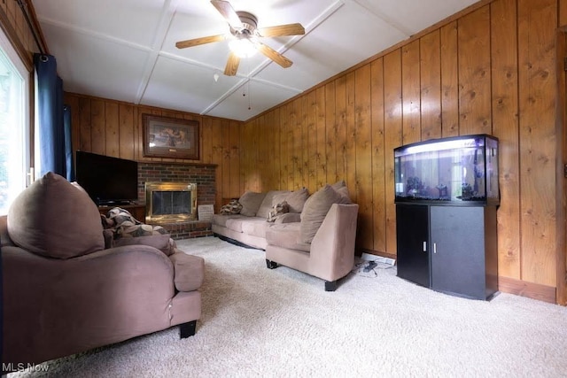5940 Hansom Dr, Solon, OH 44139 - living room featuring light carpet, a ceiling fan, wooden walls, and a fireplace