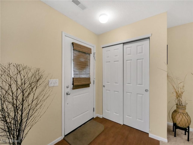 6010 Turnwood Dr, Westerville, OH 43081 - entryway with dark wood-type flooring and baseboards