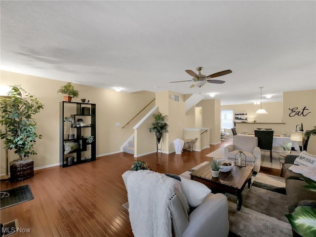 6010 Turnwood Dr, Westerville, OH 43081 - living area featuring stairs, a ceiling fan, wood finished floors, and baseboards