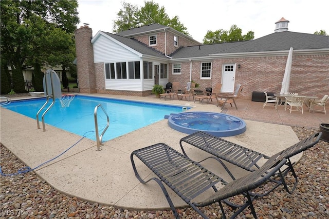 1818 Steiner St NW, North Canton, OH 44720 - view of pool featuring a sunroom, a patio area, and a pool with connected hot tub