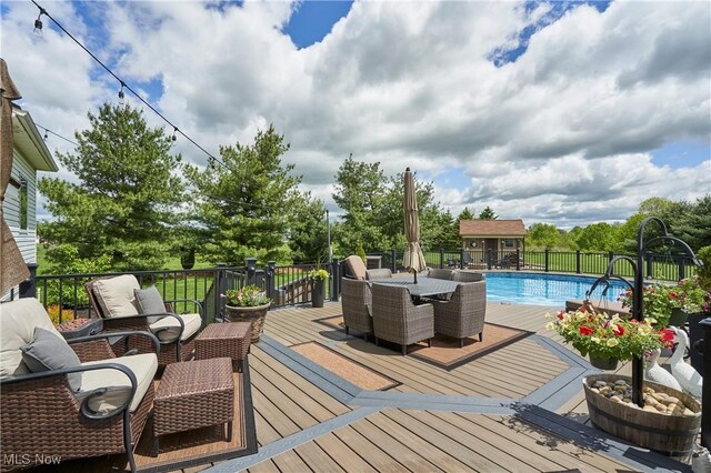 7355 Hunters Glen Ln, Seville, OH 44273 - deck with outdoor dining space and an outdoor structure