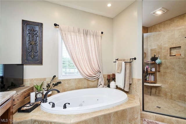 7355 Hunters Glen Ln, Seville, OH 44273 - bathroom featuring a jetted tub, tiled shower, and vanity
