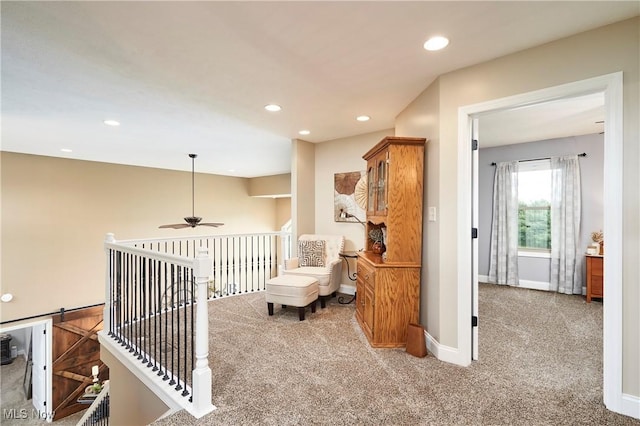 7355 Hunters Glen Ln, Seville, OH 44273 - living area featuring carpet, a ceiling fan, recessed lighting, baseboards, and an upstairs landing