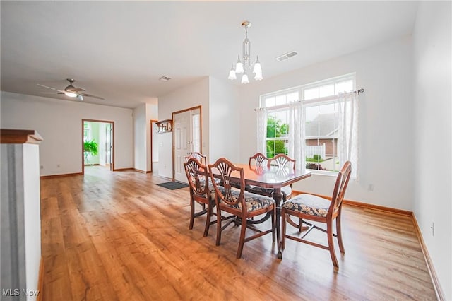 217 Greenbriar Ln, Dalton, OH 44618 - dining area with a chandelier, light wood-type flooring, baseboards, and a ceiling fan