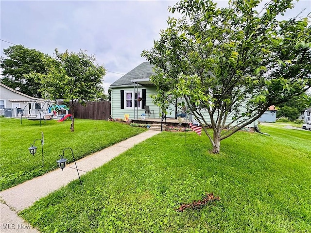 418 Main St, Philo, OH 43771 - view of front of house featuring a shingled roof and covered porch