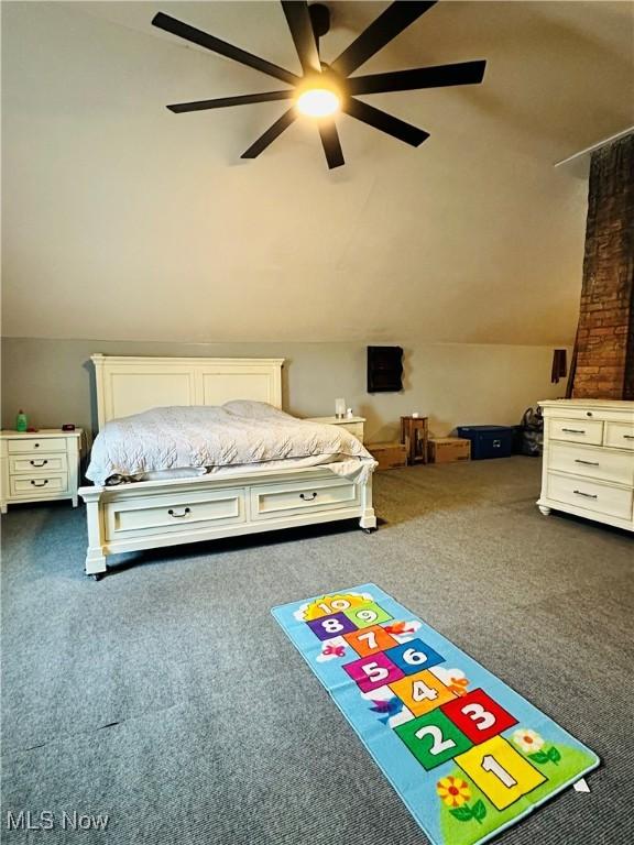 418 Main St, Philo, OH 43771 - bedroom featuring dark colored carpet, vaulted ceiling, and ceiling fan