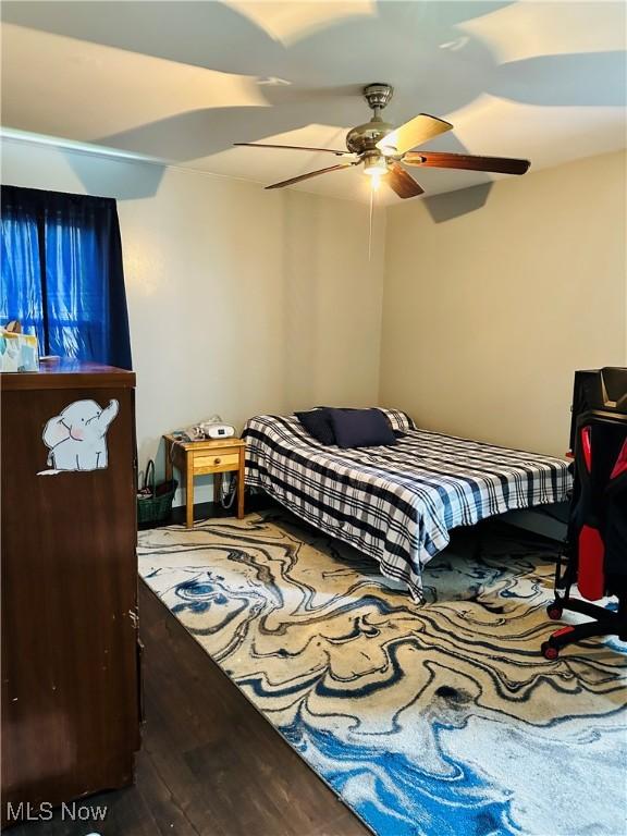418 Main St, Philo, OH 43771 - bedroom featuring wood finished floors and a ceiling fan