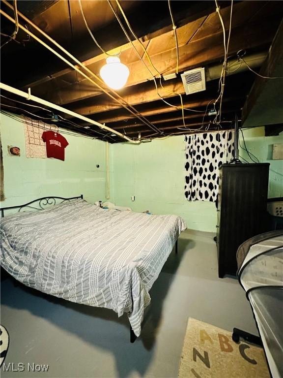 418 Main St, Philo, OH 43771 - bedroom featuring finished concrete floors